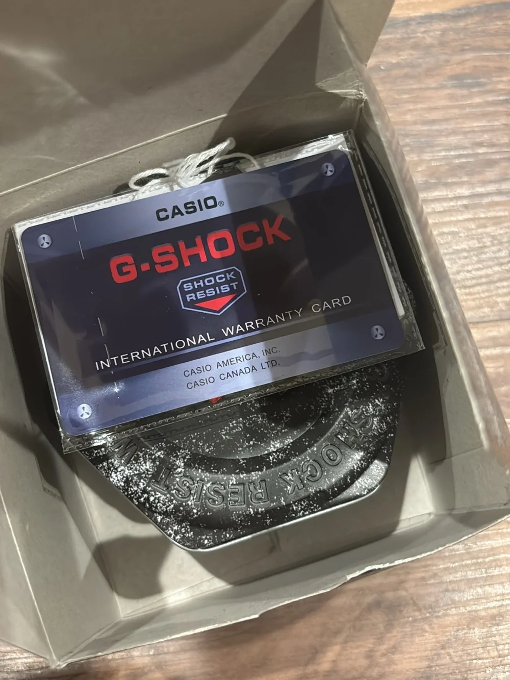Casio G-Shock Blue Watch with White Bezel and Red Accents